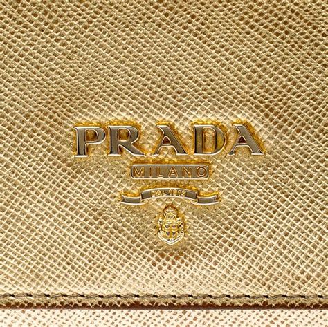 prada gold rim wallet